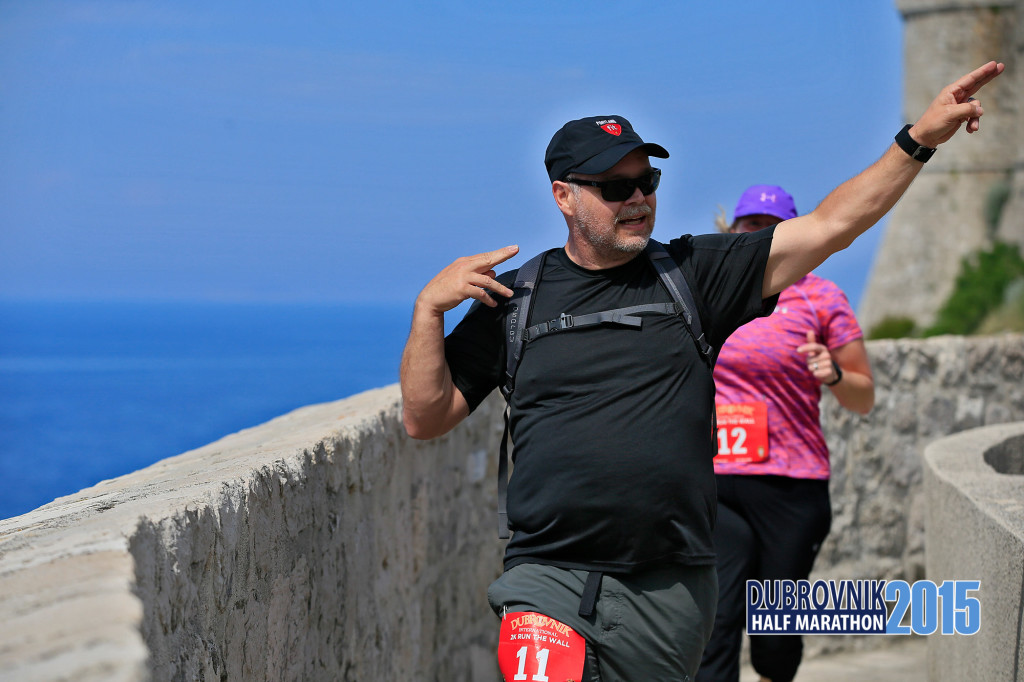 Glenn running from the top of the wall
