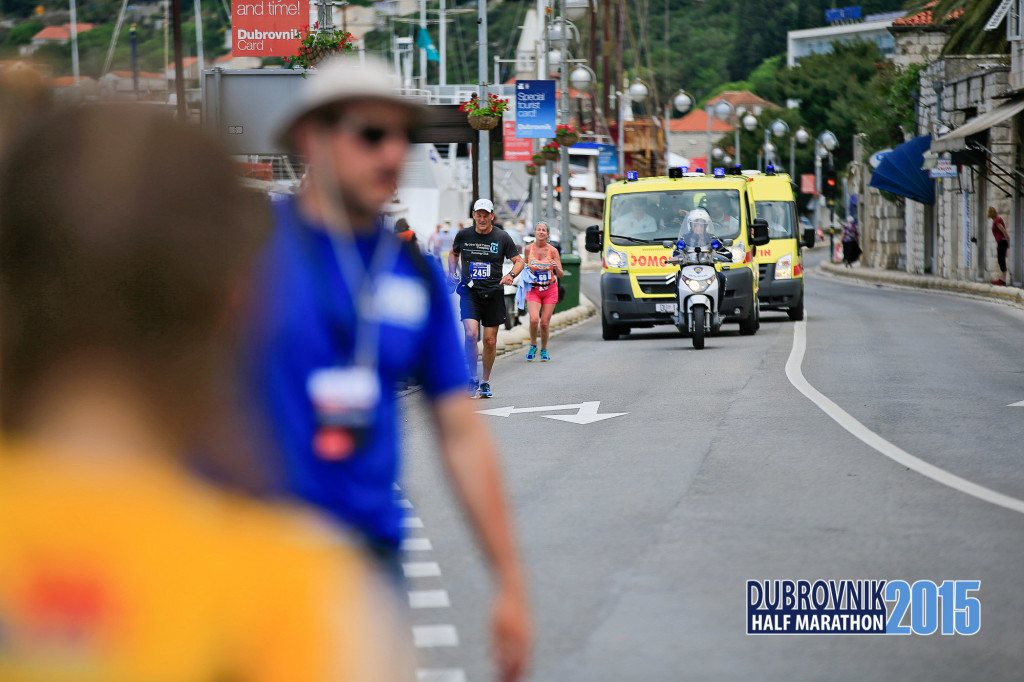 The police and medics following behind the last runner.