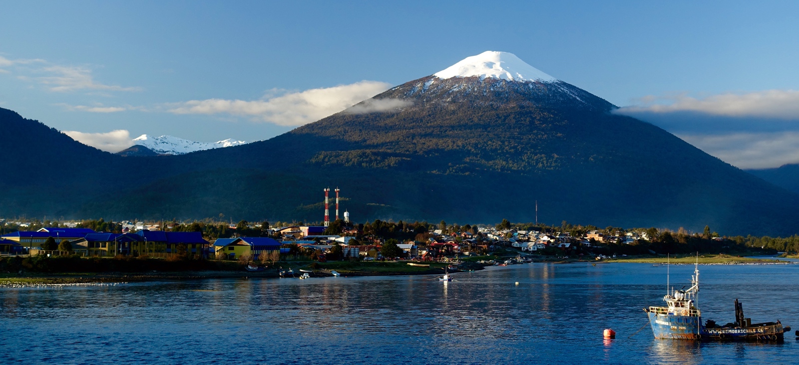 Visiting the town of Rio Negro, nestled under a volcano that looks like how I used to draw mountains as a child...a perfect cone topped with snow.