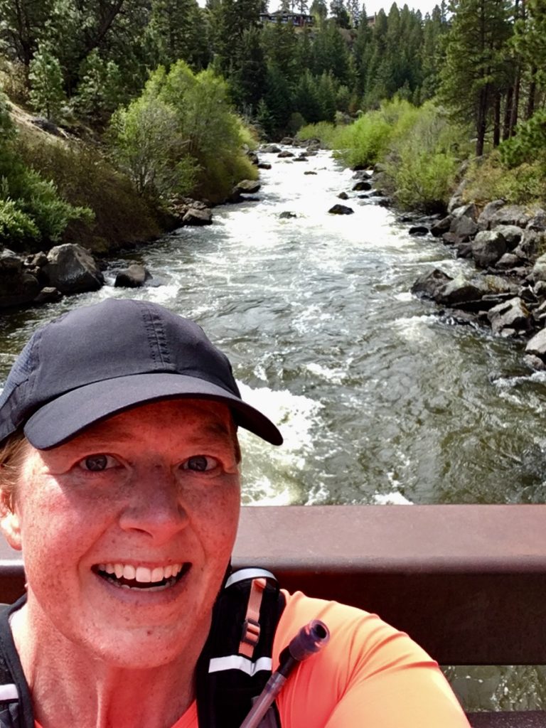 Me running along a beautiful river in Bend, OR