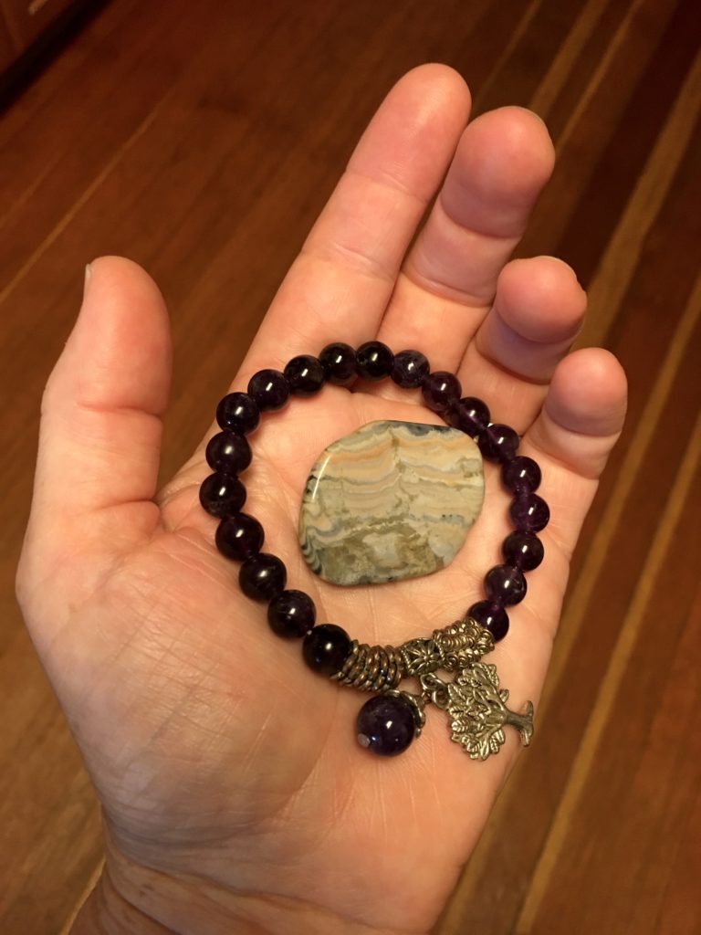 My mother's amethyst bead bracelet and "worry stone" - items that she carried on her body