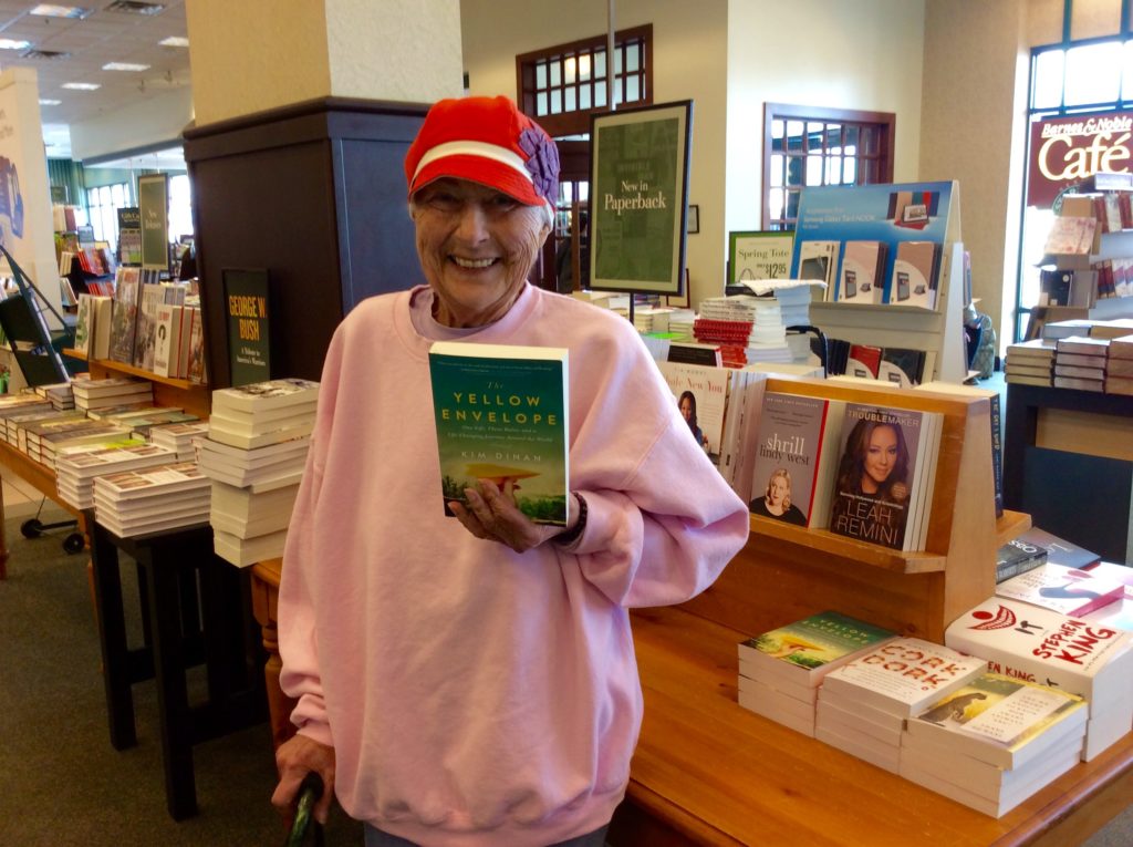 My mother in the outfit she wanted to be cremated in - grey sweatpants, pink sweatshirt (both about four times too big for her) and her flowered hat.