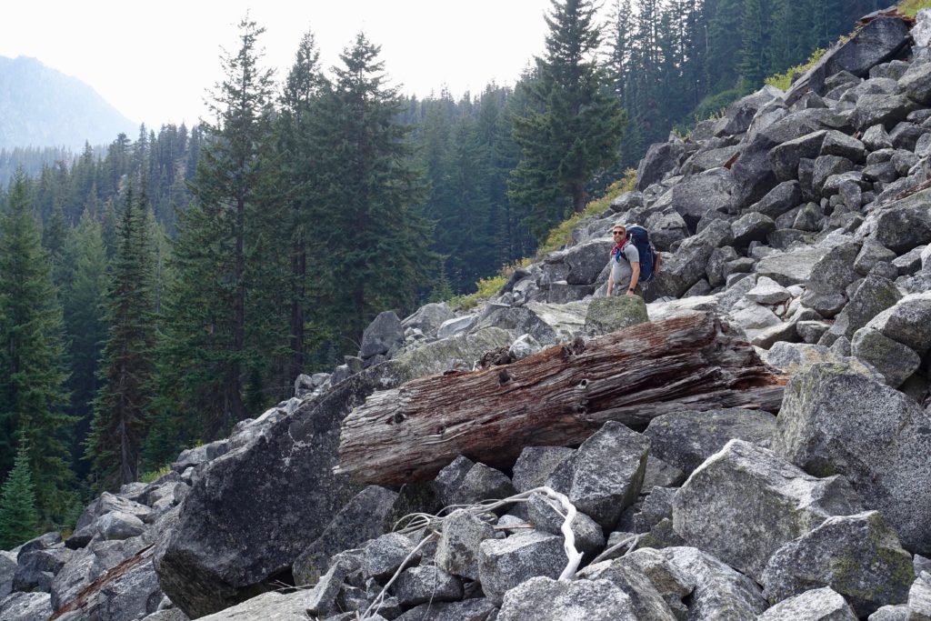 Kyle waiting for us slow pokes in one of several boulder fields the trail traverses.