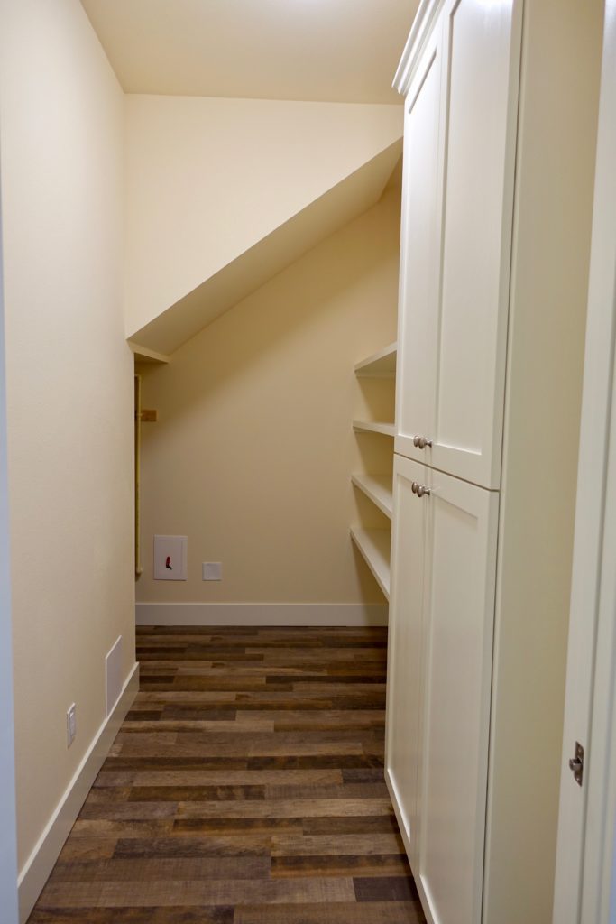 Storage room, with built-in cupboards and shelves