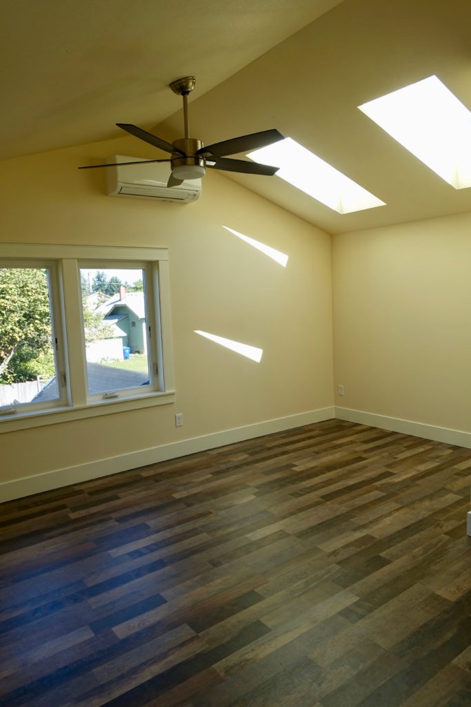 The bedroom, with skylights and vaulted ceilings, feels nice and roomy.