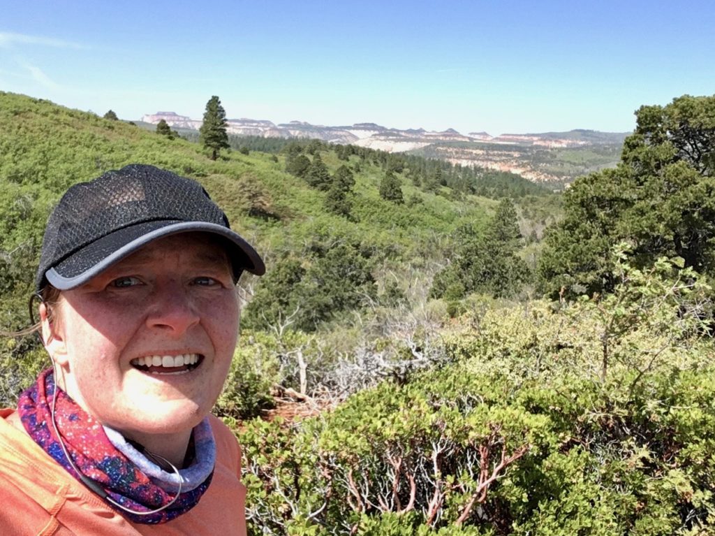 Enjoying my time running trails with views of Zion National Park in the distance.