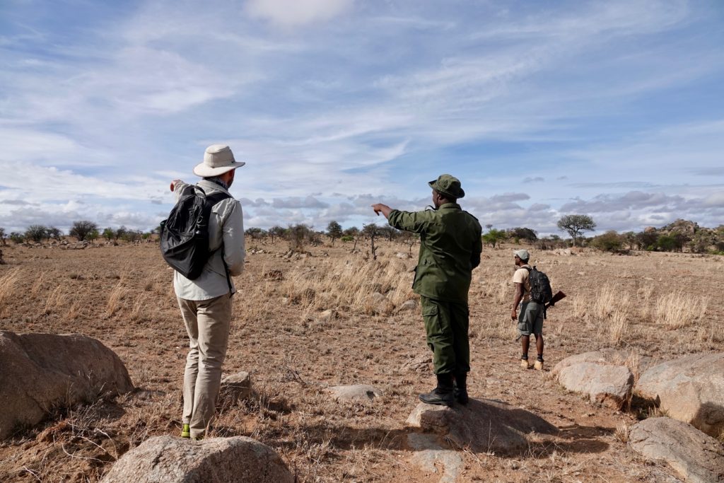 John (left), James our Serengeti Park Ranger escort (center), and Douglas our Dorobo Safaris guide (right) scouting out where to hike to next.