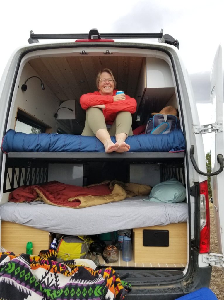 Me enjoying myself in the back of the rented campervan