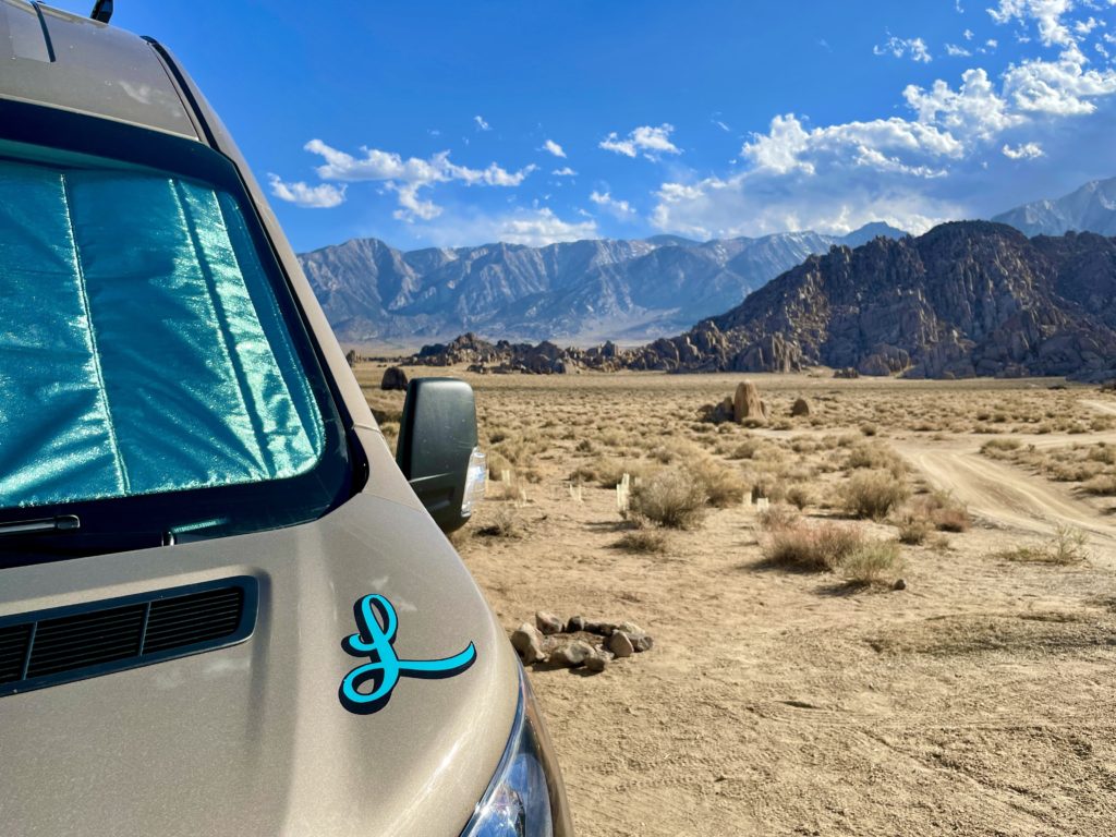 Our new campervan with a monogrammed “L” on the hood.