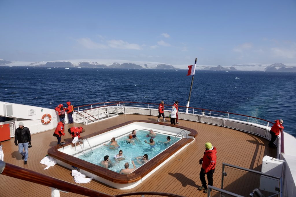 People swimming on the boat in Antarctica