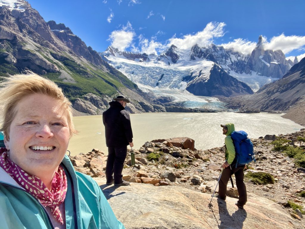 Laguna Torre against the backdrop of Cerro Torre's needle-like peak rising high into the clouds.